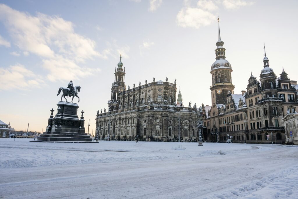 Snow-covered historic buildings in Dresden during winter, illustrating the worst time to visit Germany for harsh weather.